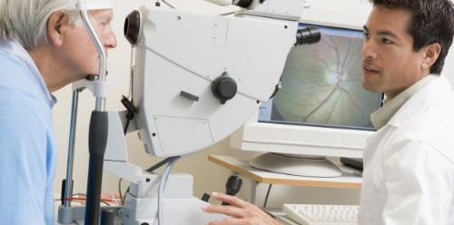 Physician inspecting patient's eye