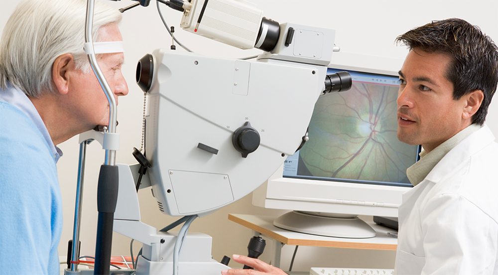 Patient getting eyes checked by doctor